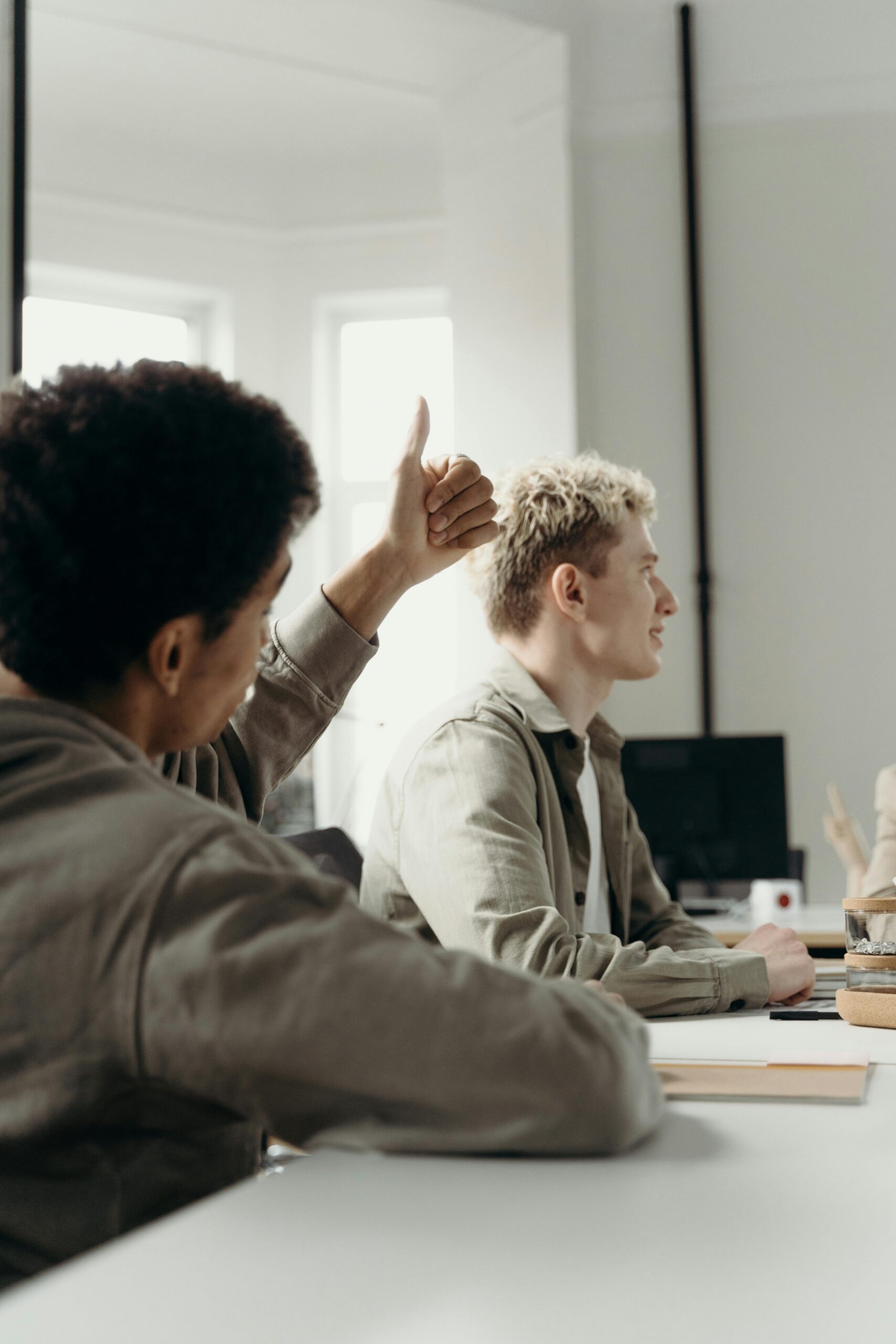Professional team engaged in collaborative discussion in a modern office setting.